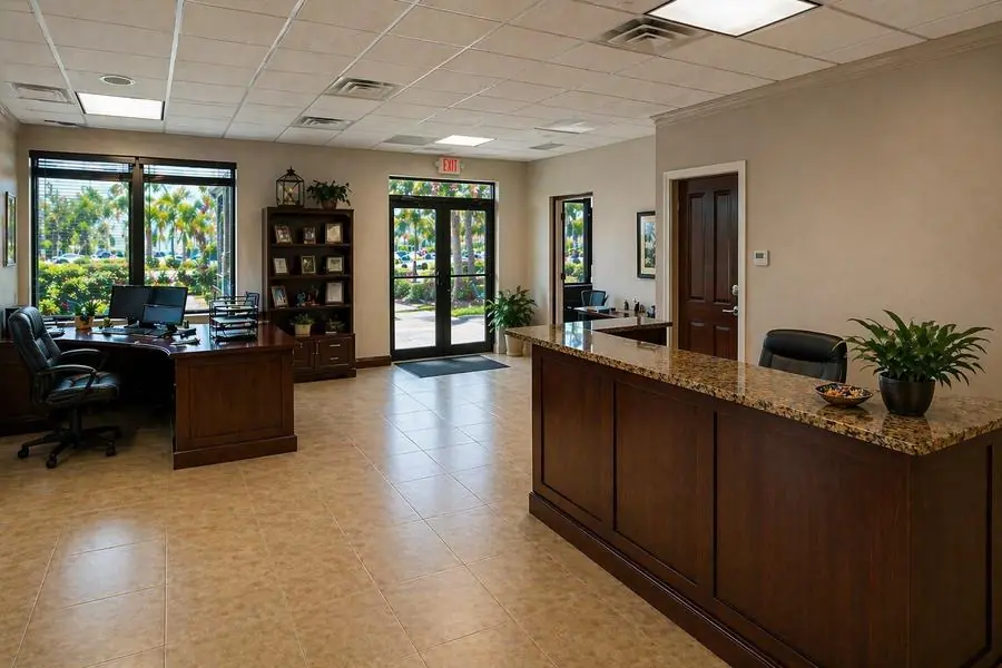 Office reception area with front desk counter and waiting space